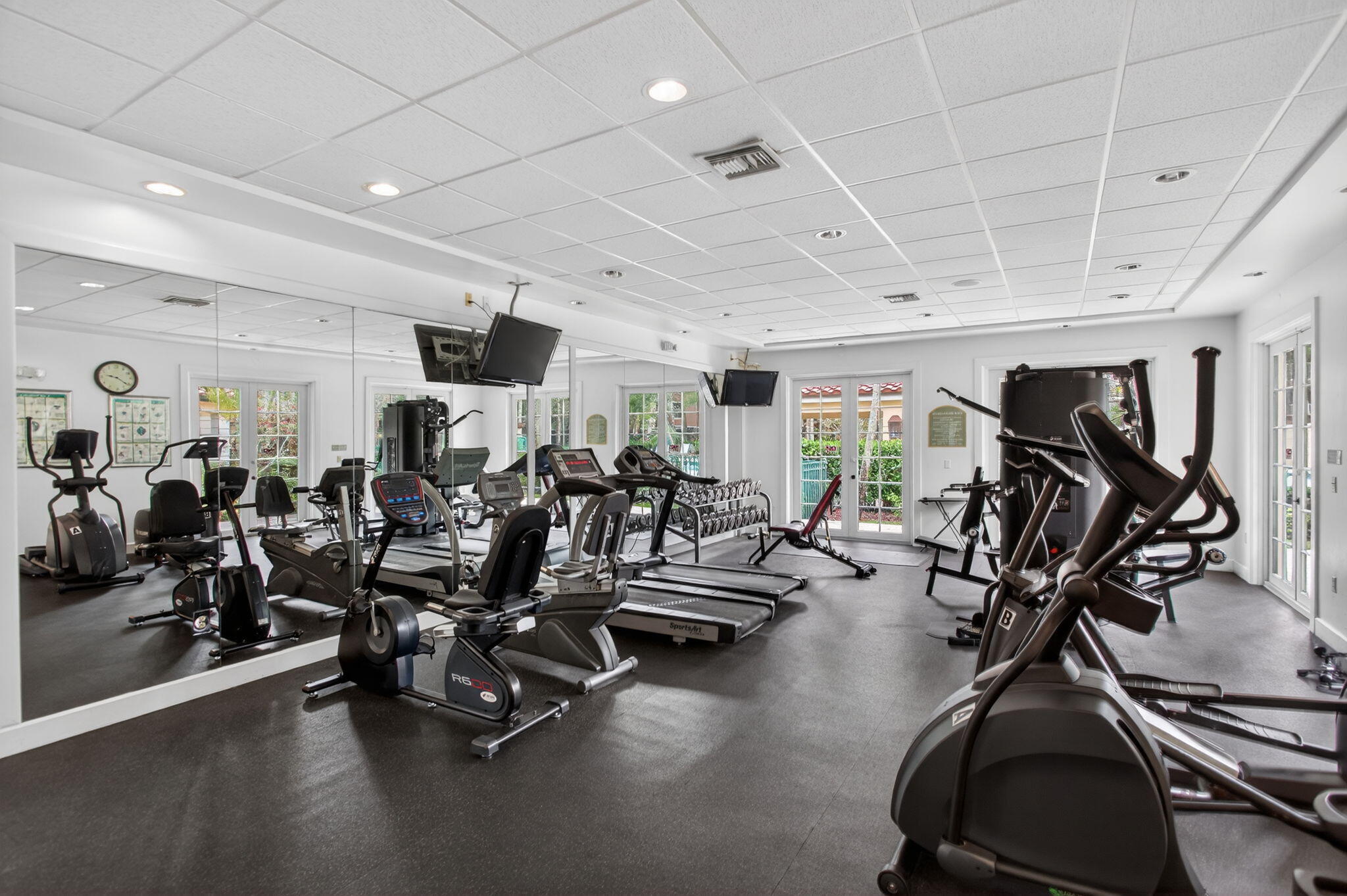 6890 West Sample Road, Unit 6890 Pompano Beach, FL 33063 - Photo 20 of 36 a view of a room with gym equipment