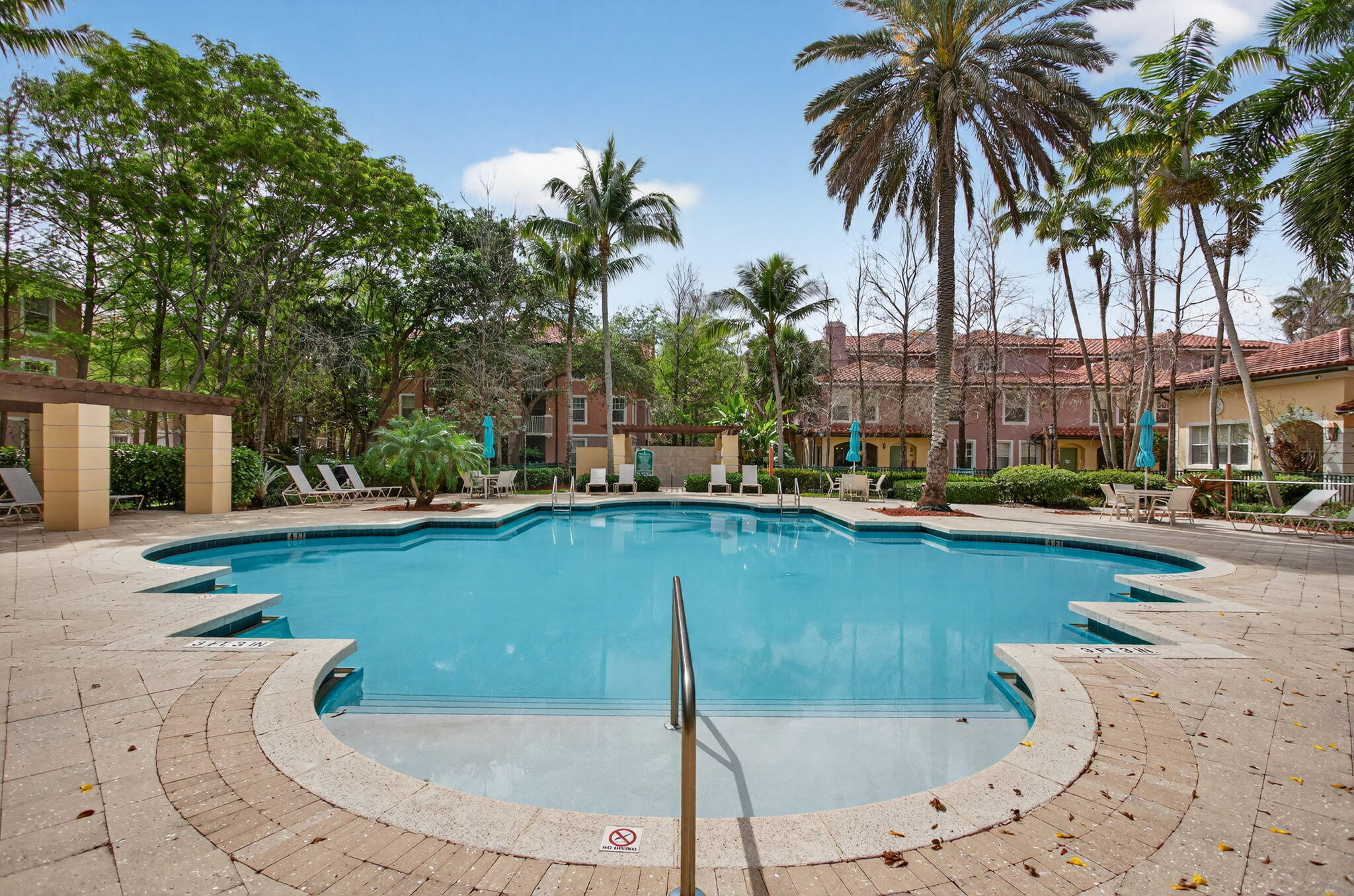 6890 West Sample Road, Unit 6890 Pompano Beach, FL 33063 - Photo 24 of 36 a swimming pool with outdoor seating and yard