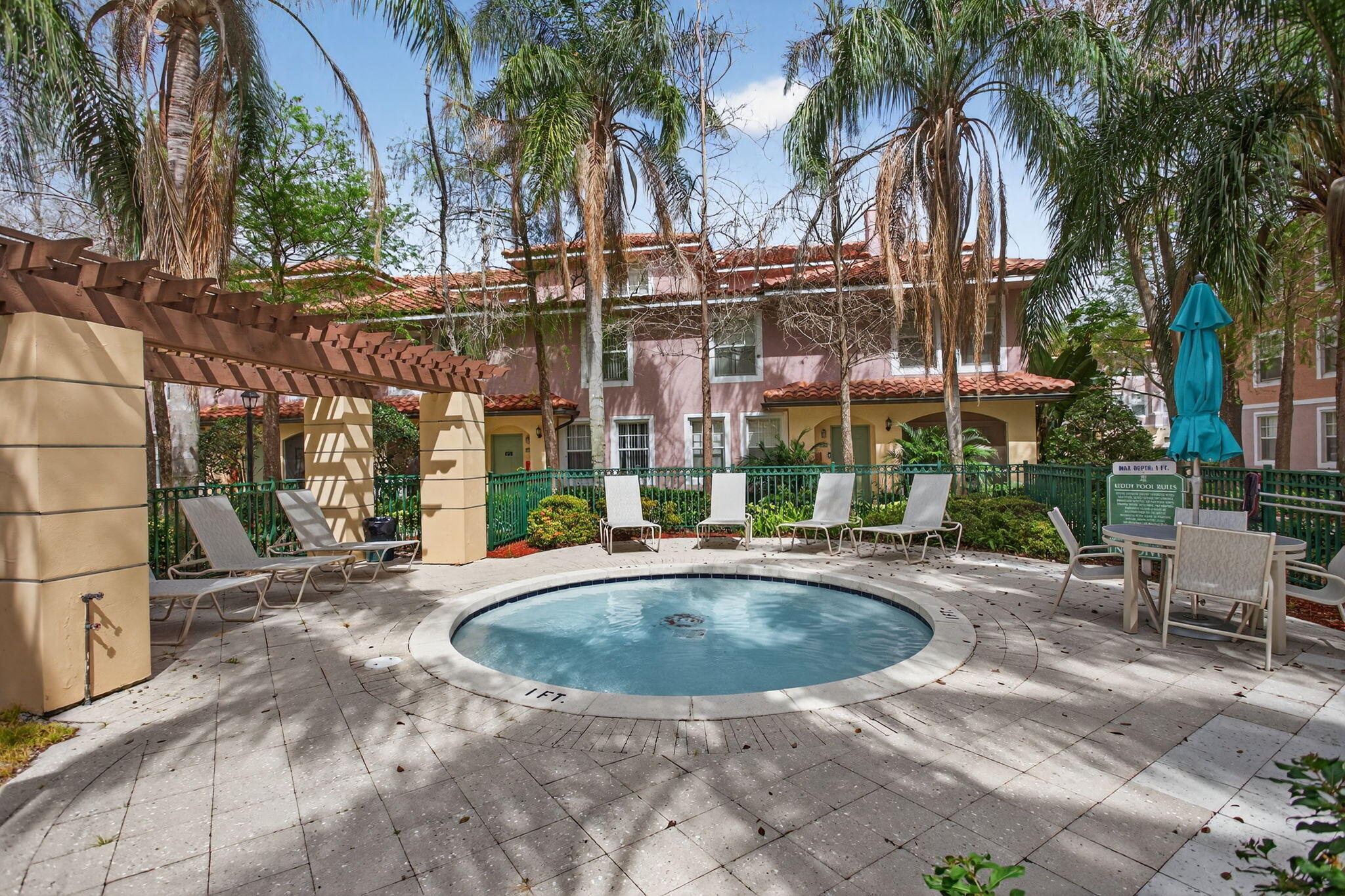 6890 West Sample Road, Unit 6890 Pompano Beach, FL 33063 - Photo 26 of 36 a view of a building with a swimming pool