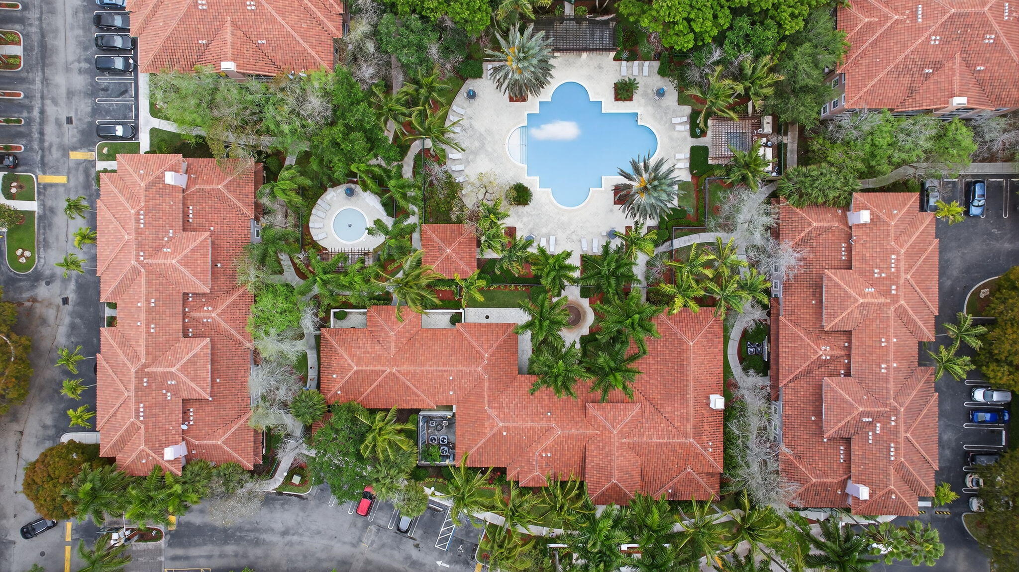 6890 West Sample Road, Unit 6890 Pompano Beach, FL 33063 - Photo 3 of 36 an aerial view of a house with outdoor space and a lake view