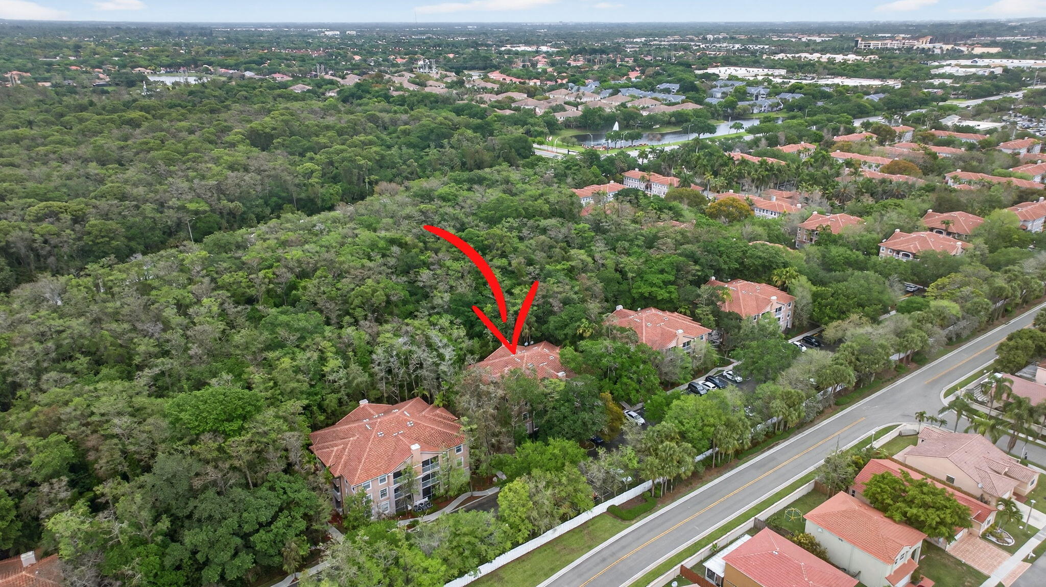 6890 West Sample Road, Unit 6890 Pompano Beach, FL 33063 - Photo 31 of 36 an aerial view of residential houses with outdoor space and trees