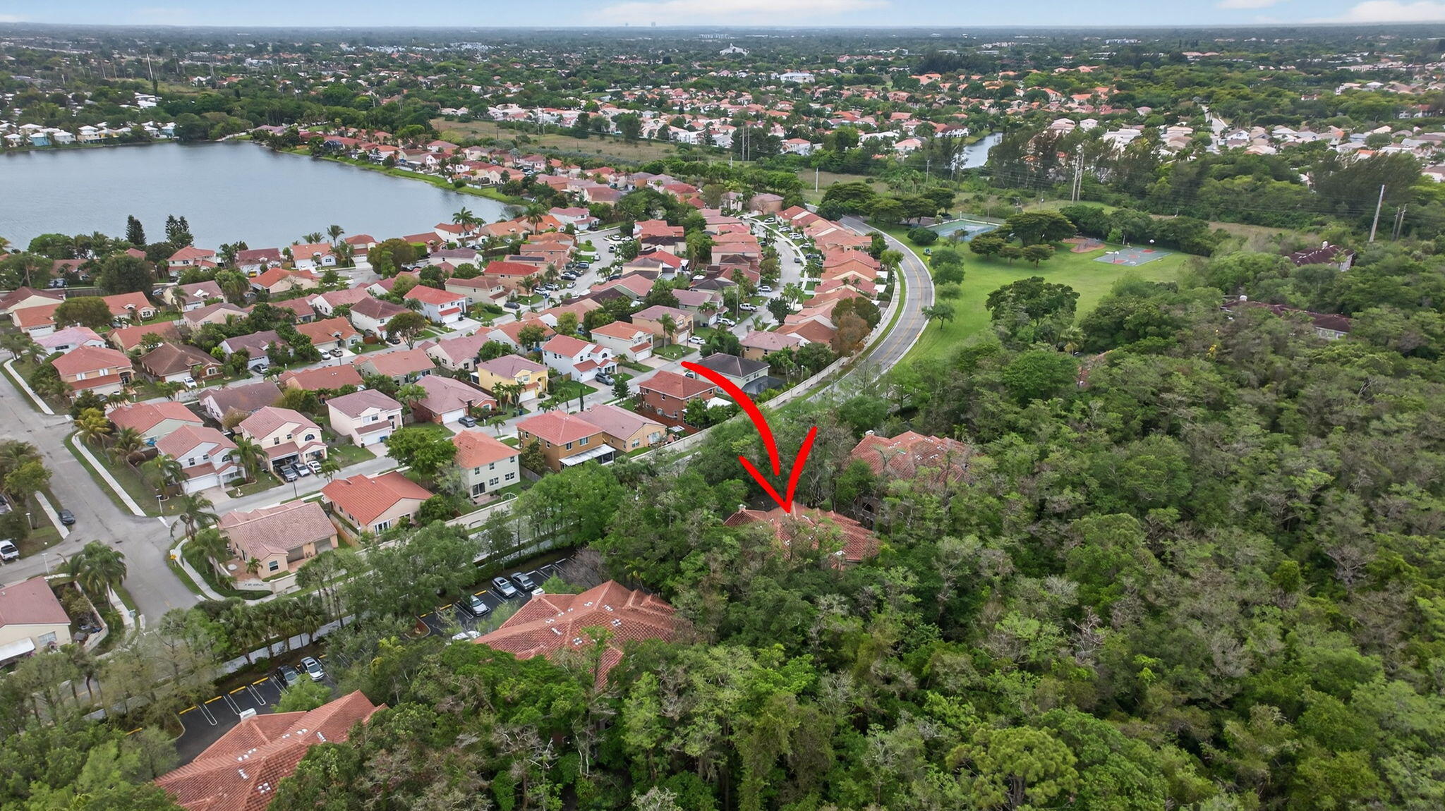 6890 West Sample Road, Unit 6890 Pompano Beach, FL 33063 - Photo 35 of 36 an aerial view of lake and residential houses with outdoor space