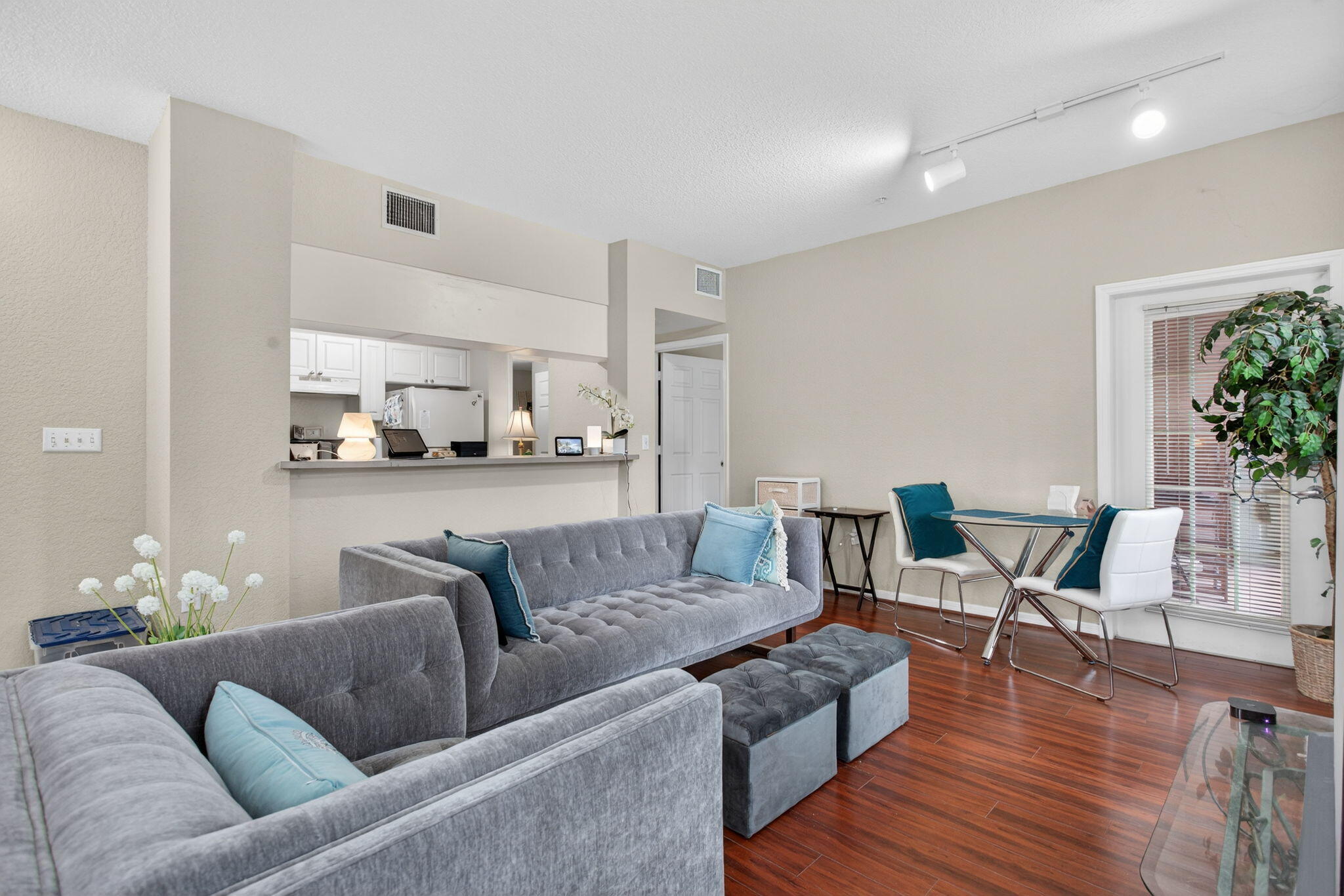 6890 West Sample Road, Unit 6890 Pompano Beach, FL 33063 - Photo 5 of 36 a living room with furniture and wooden floor
