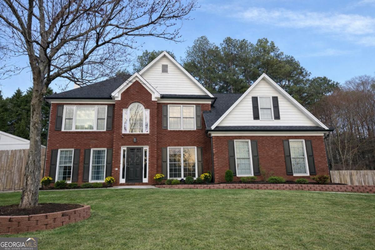 2425 Harbin Springs Cove Dacula, GA 30019 - Photo 1 of 1 front view of a house with a yard