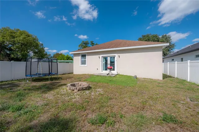 a backyard of a house with a yard and garage