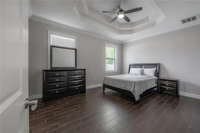 a bedroom with a bed and a dresser