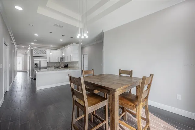 a kitchen with a table and chairs in it