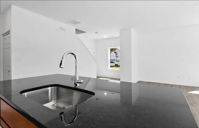 a kitchen with a sink and a microwave