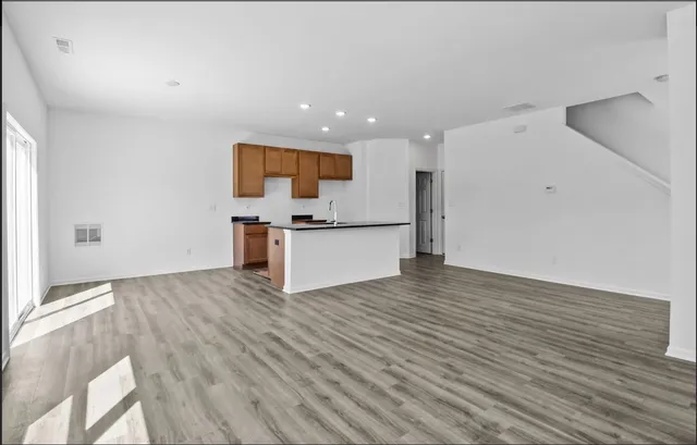 a view of kitchen with wooden floor