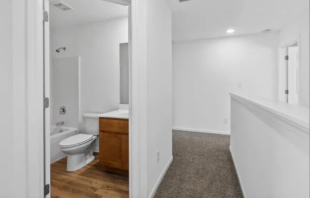 a bathroom with a toilet and a sink
