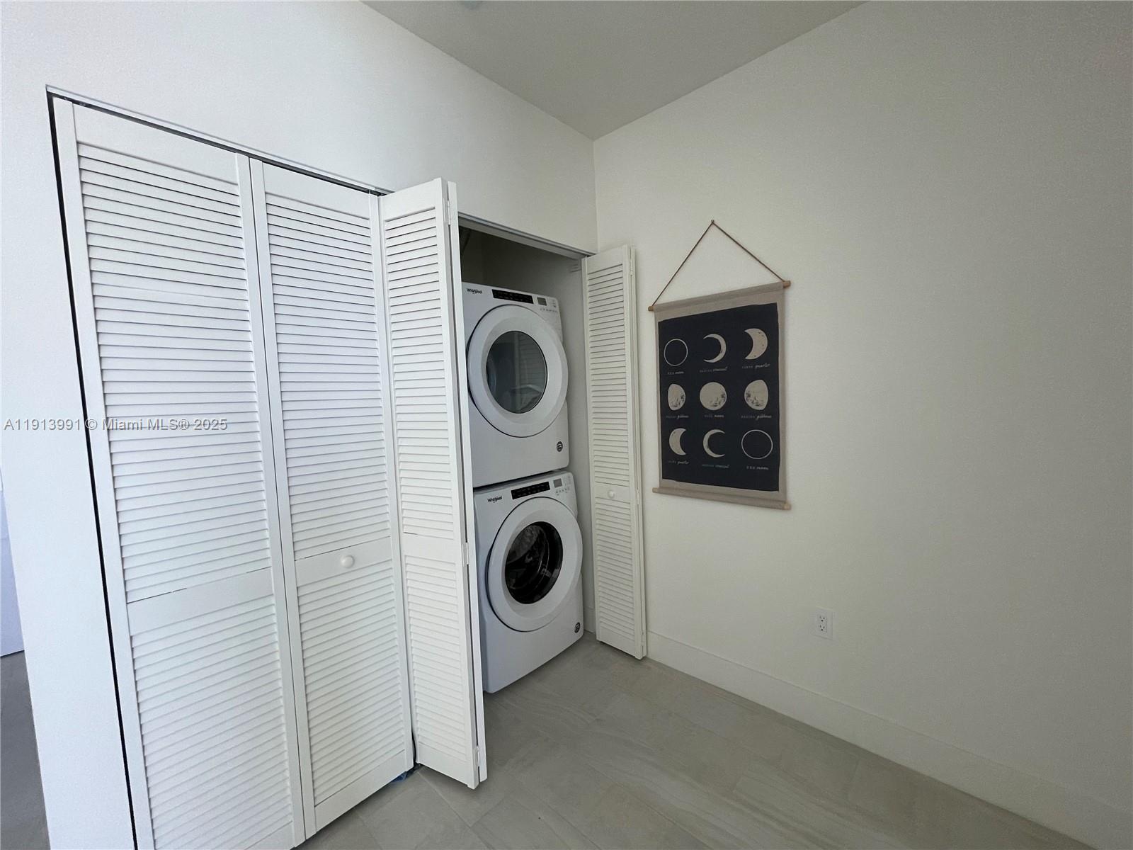 2000 Metropica Way, Unit 605 Sunrise, FL 33323 - Photo 23 of 24 a utility room with dryer and washer