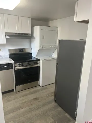 a kitchen with a stove and a refrigerator