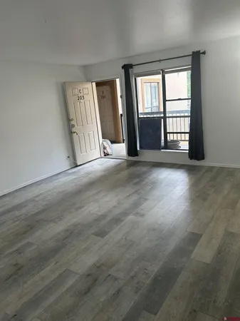 a view of an empty room with a window