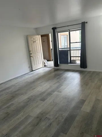 a view of an empty room with a window