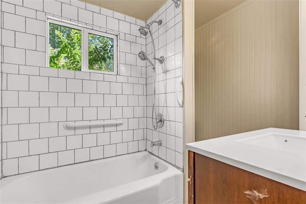 575 State Rte 908 Extension Tarentum, PA 15084 - Photo 14 of 32 a bathroom with a bathtub and window