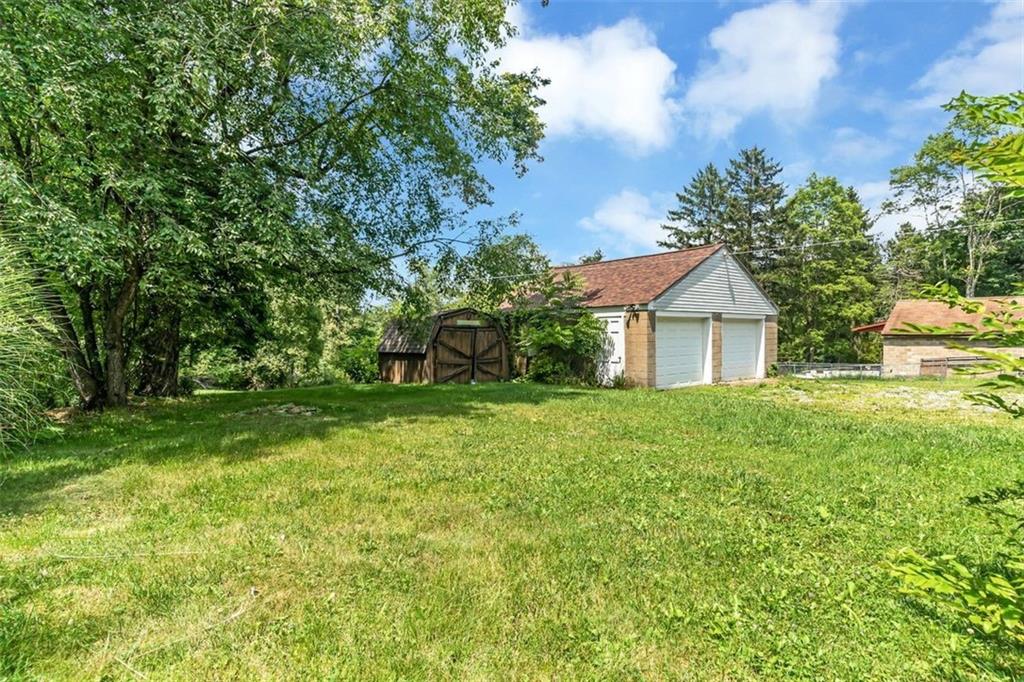 575 State Rte 908 Extension Tarentum, PA 15084 - Photo 29 of 32 a front view of a house with garden