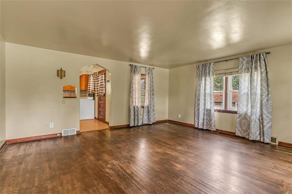 575 State Rte 908 Extension Tarentum, PA 15084 - Photo 7 of 32 an empty room with wooden floor and windows