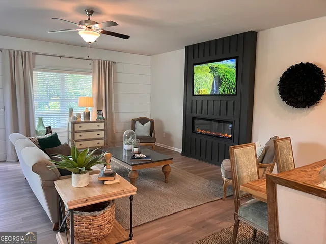 a living room with furniture and a flat screen tv