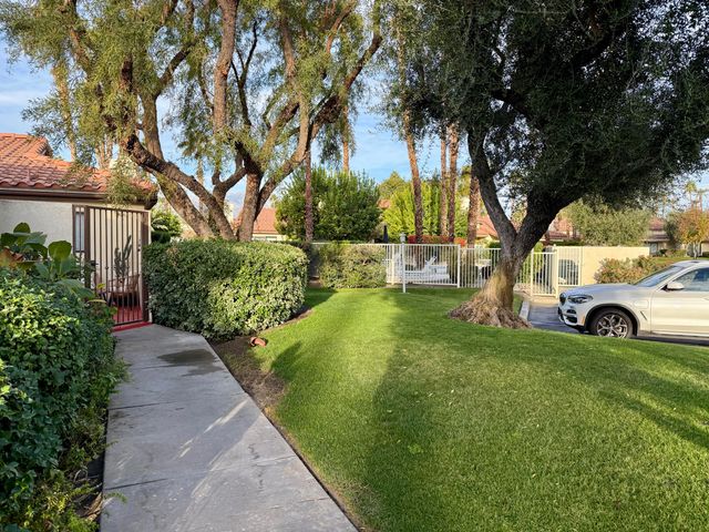 a view of a backyard with a garden