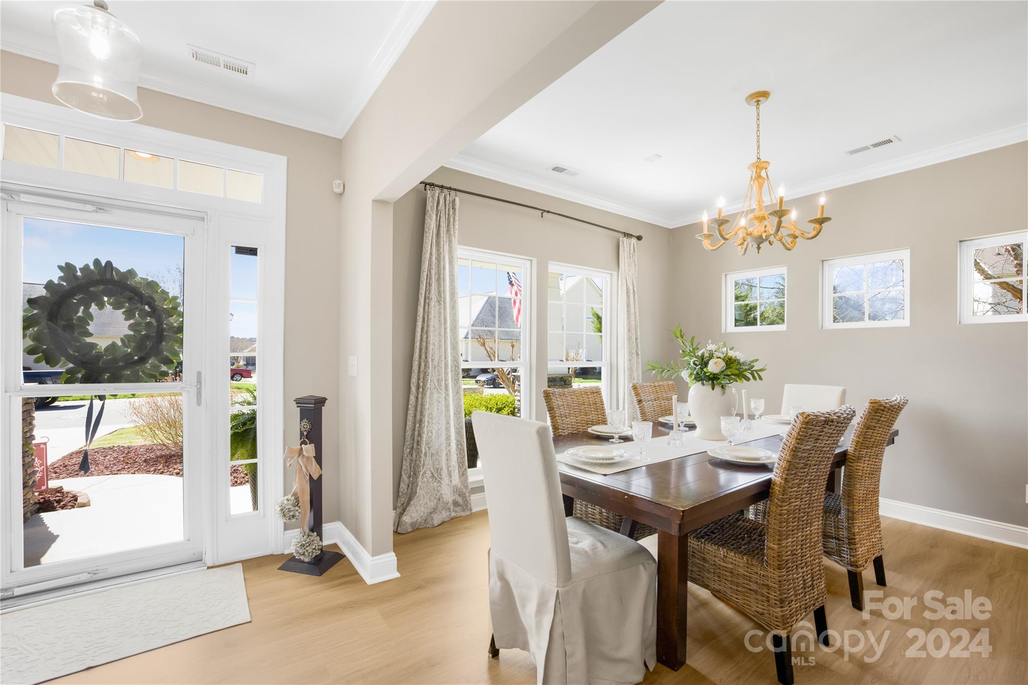 1003 Sipes Place Indian Trail, NC 28079 - Photo 12 of 45 a view of a dining room with furniture and a chandelier