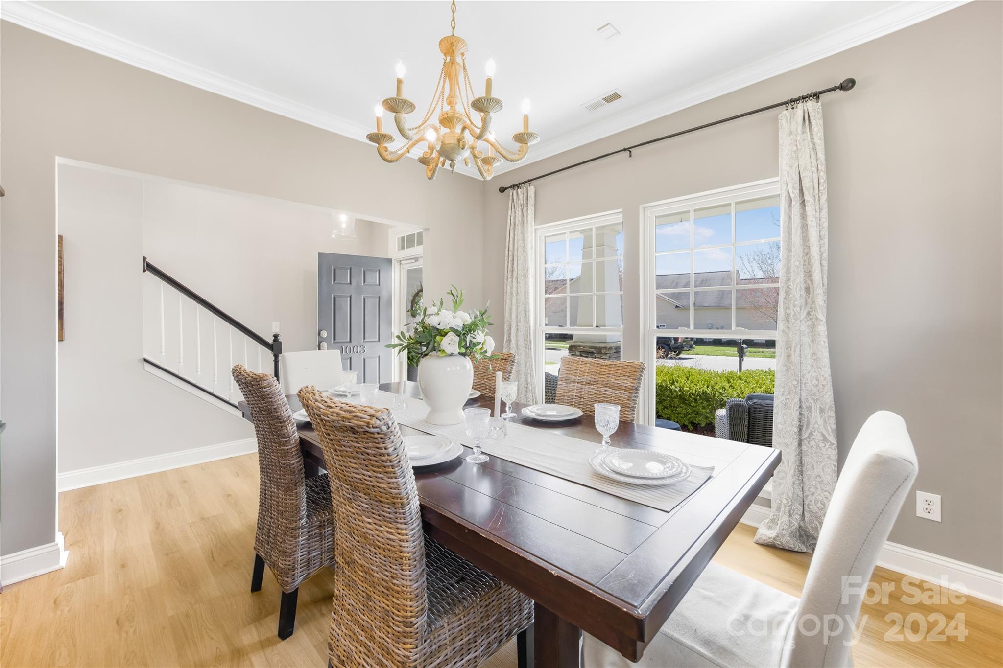 1003 Sipes Place Indian Trail, NC 28079 - Photo 14 of 45 a view of a dining room with furniture and a chandelier