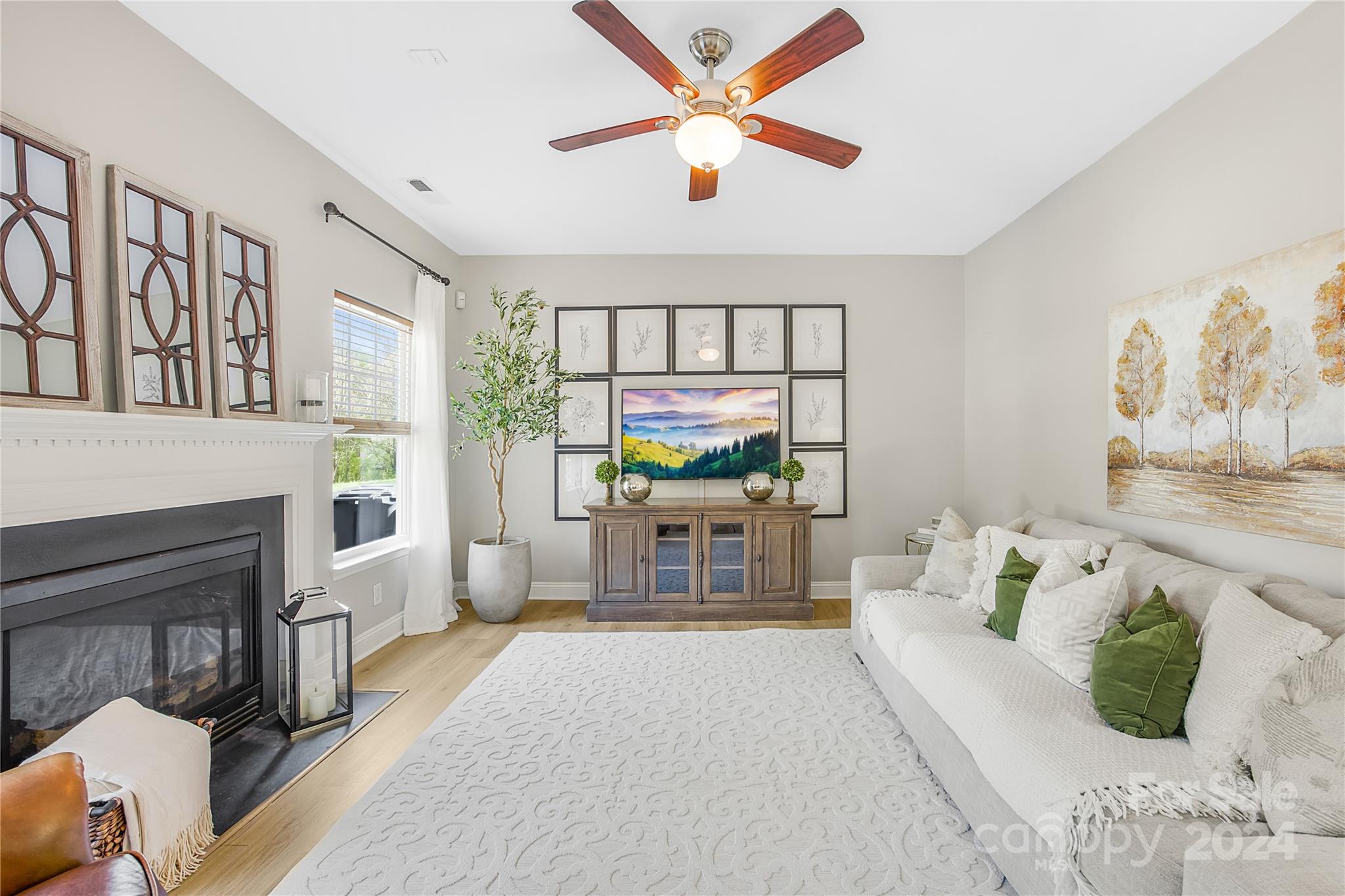 1003 Sipes Place Indian Trail, NC 28079 - Photo 18 of 45 a living room with furniture fireplace and a chandelier