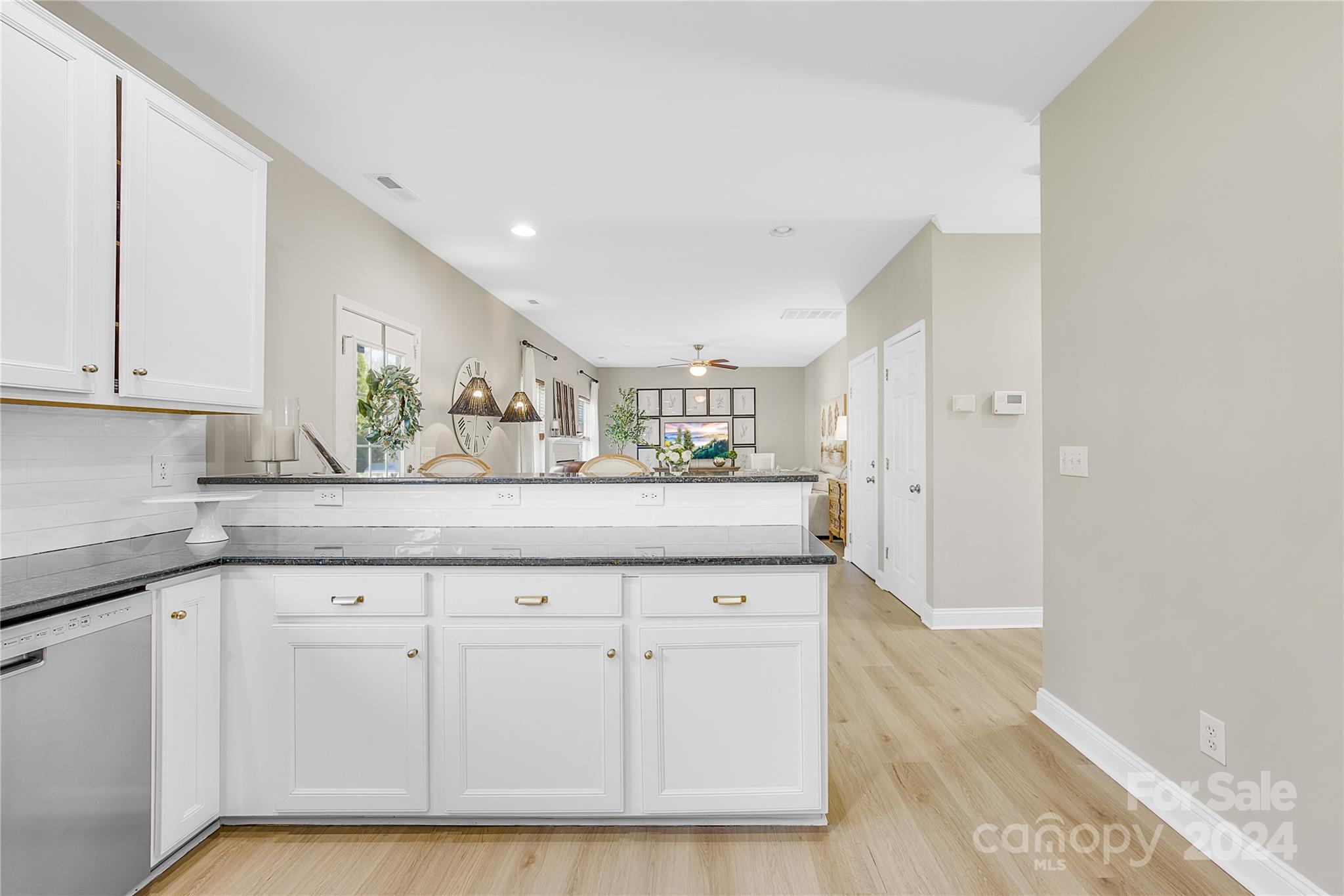 1003 Sipes Place Indian Trail, NC 28079 - Photo 22 of 45 a kitchen with white cabinets