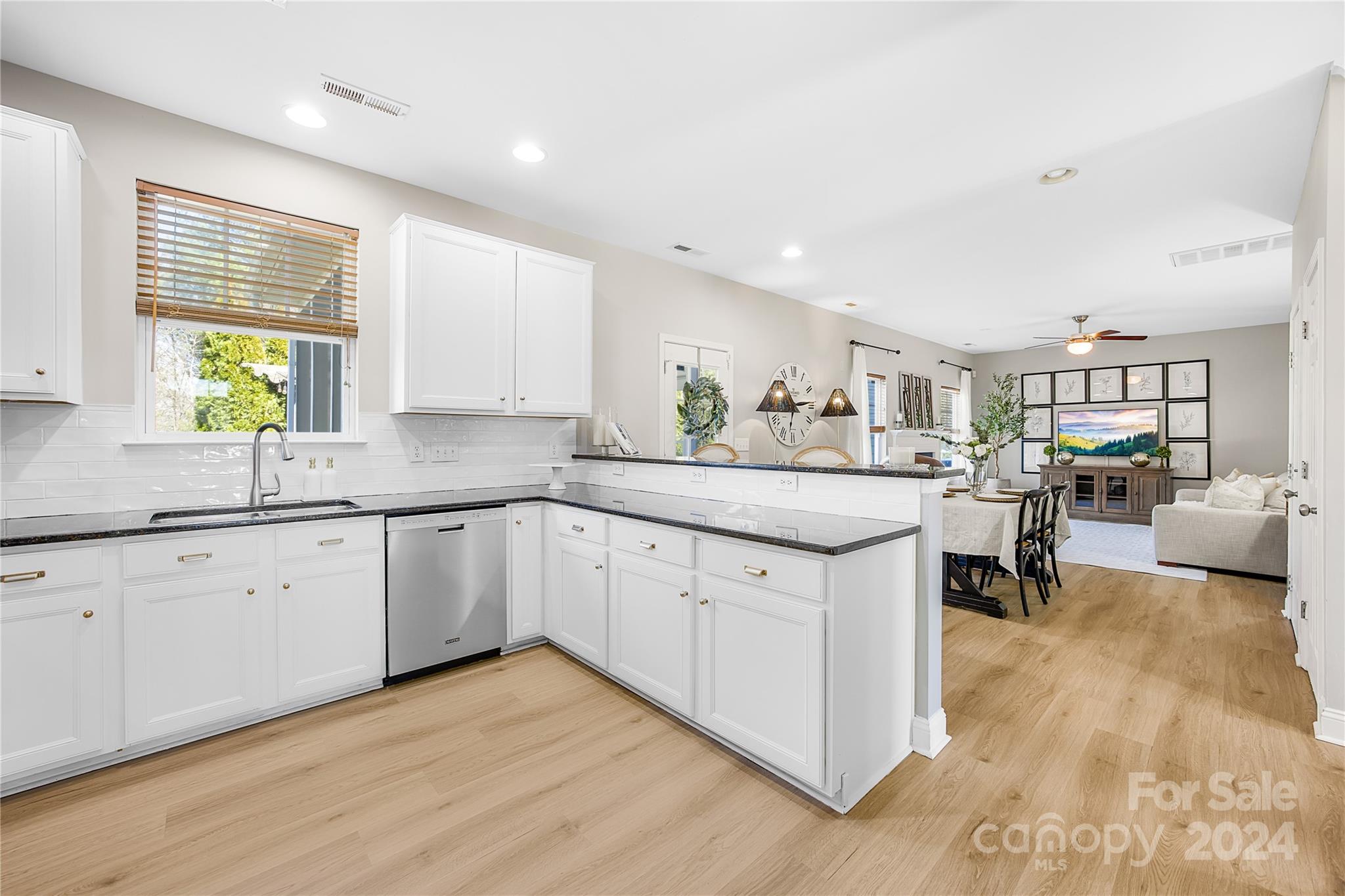 1003 Sipes Place Indian Trail, NC 28079 - Photo 23 of 45 a kitchen with granite countertop a sink and cabinets