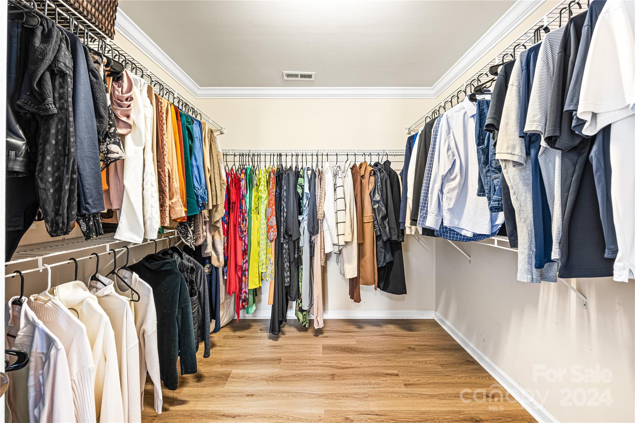 1003 Sipes Place Indian Trail, NC 28079 - Photo 29 of 45 a view of walk in closet with clothes and shoes