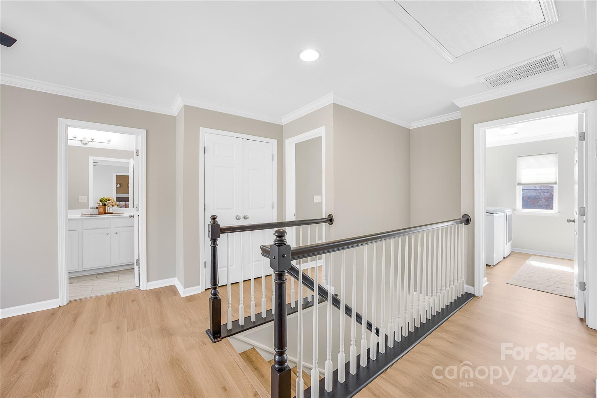 1003 Sipes Place Indian Trail, NC 28079 - Photo 33 of 45 a view of a hallway with wooden floor and windows
