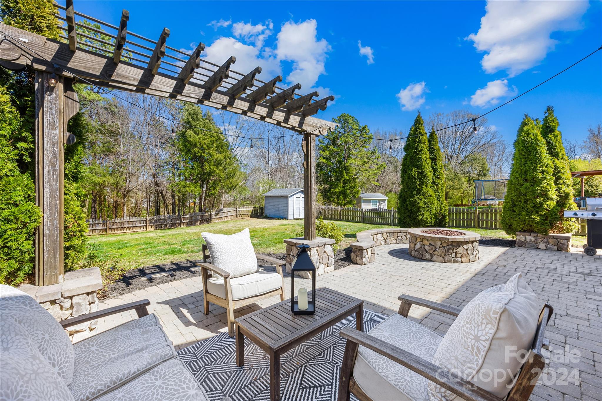 1003 Sipes Place Indian Trail, NC 28079 - Photo 40 of 45 a view of a patio with couches table and chairs and potted plants