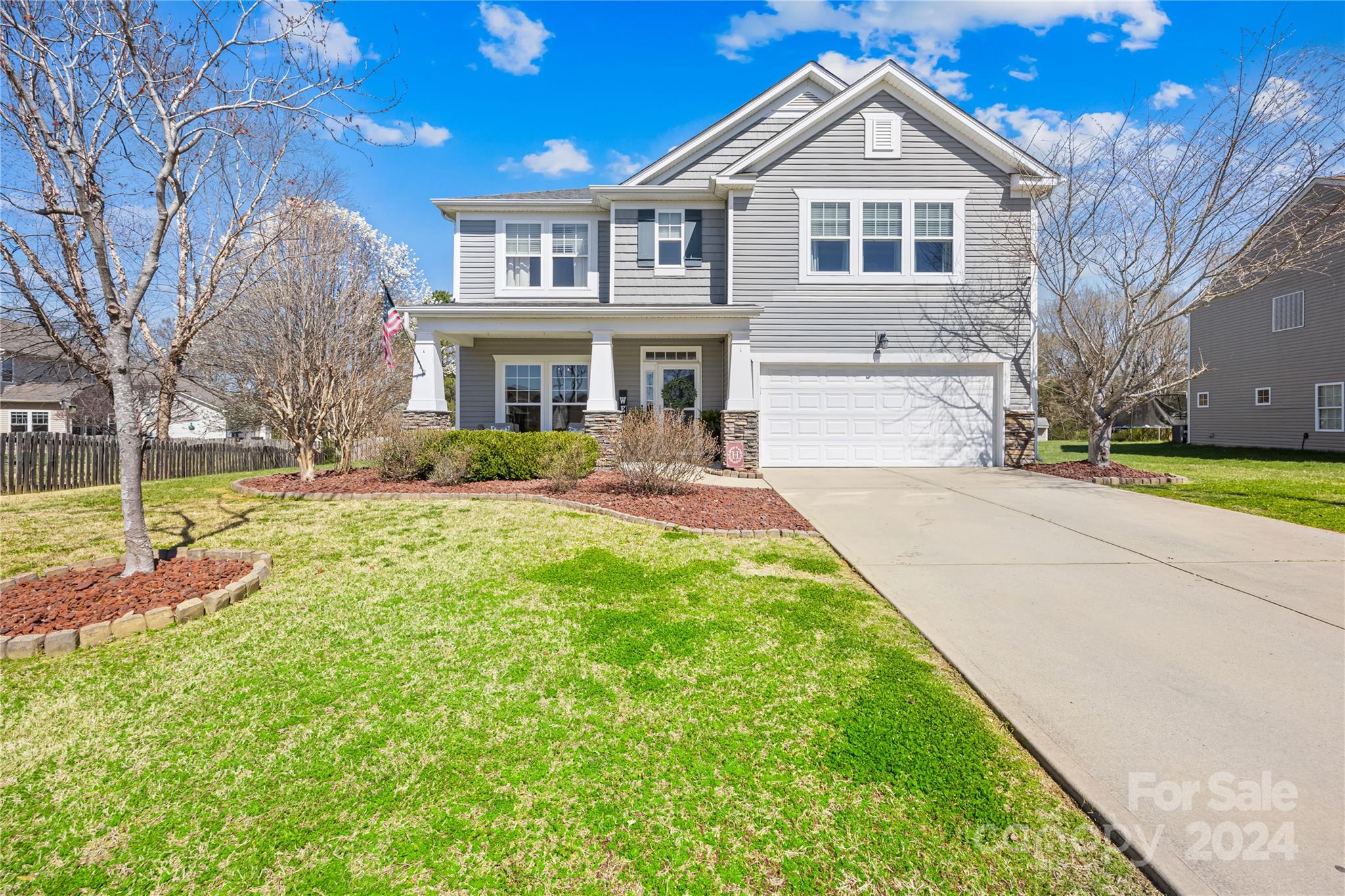 1003 Sipes Place Indian Trail, NC 28079 - Photo 7 of 45 a front view of a house with a yard