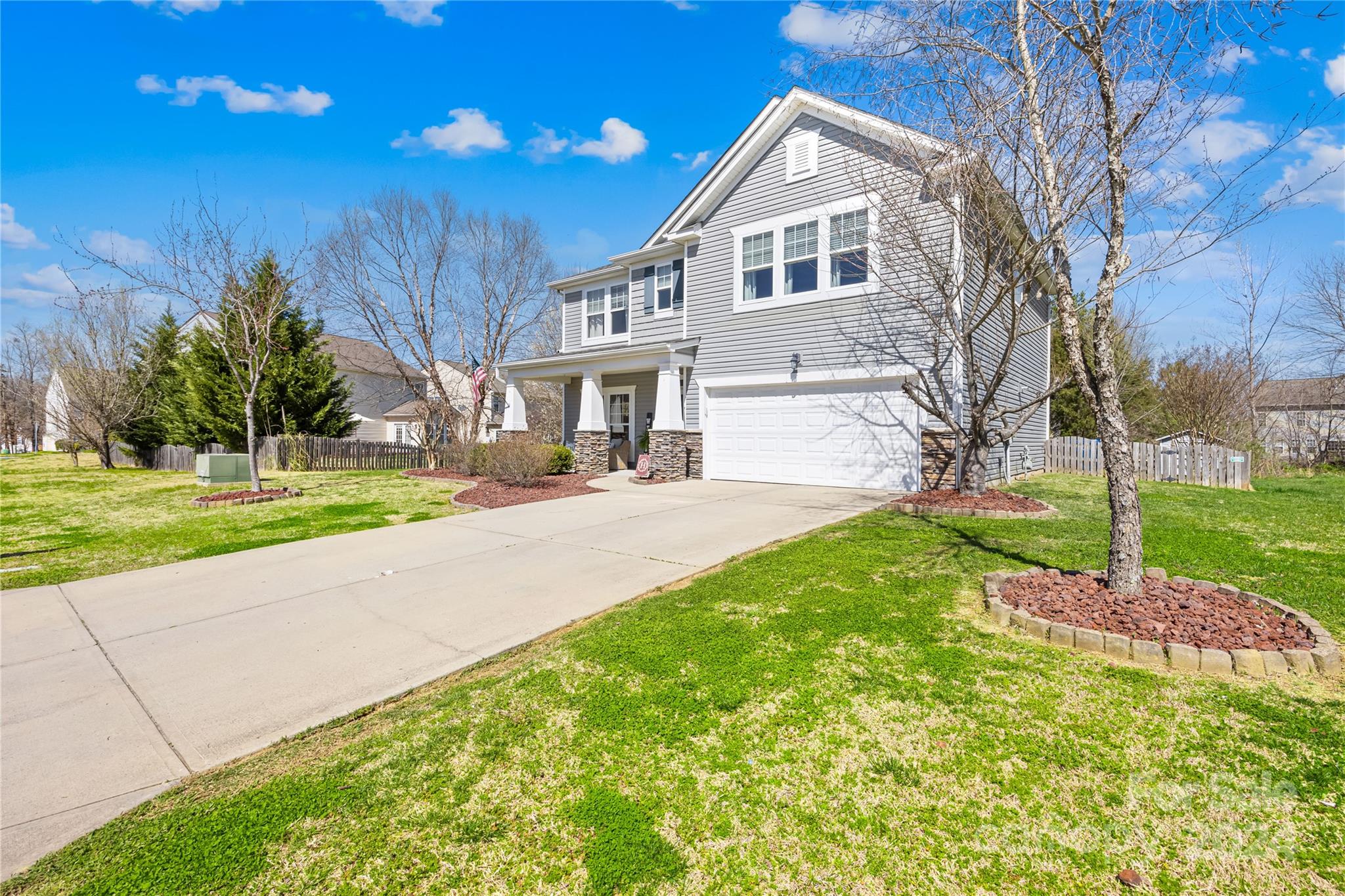 1003 Sipes Place Indian Trail, NC 28079 - Photo 8 of 45 a front view of a house with a yard and garage