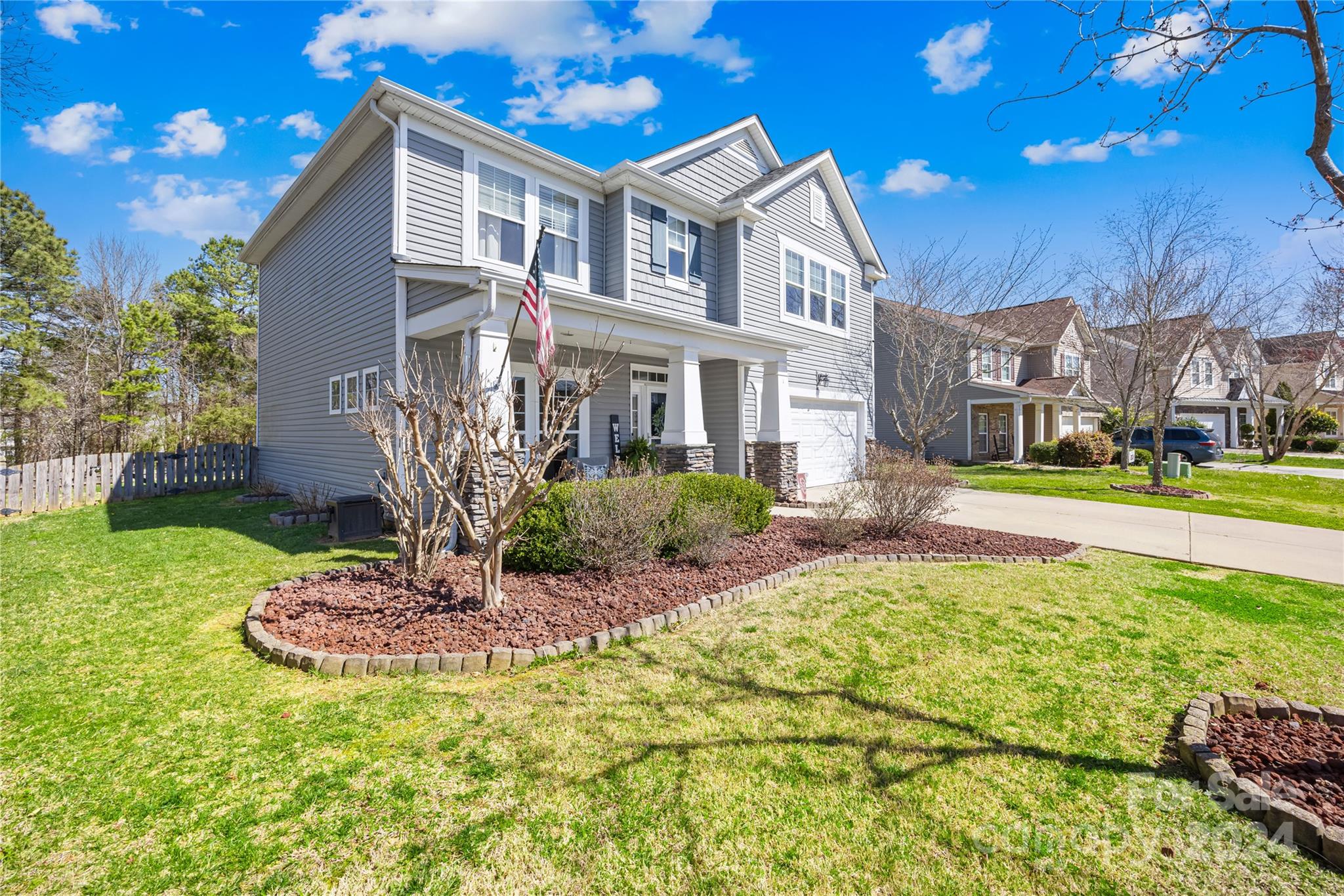 1003 Sipes Place Indian Trail, NC 28079 - Photo 10 of 45 a front view of a house with a yard