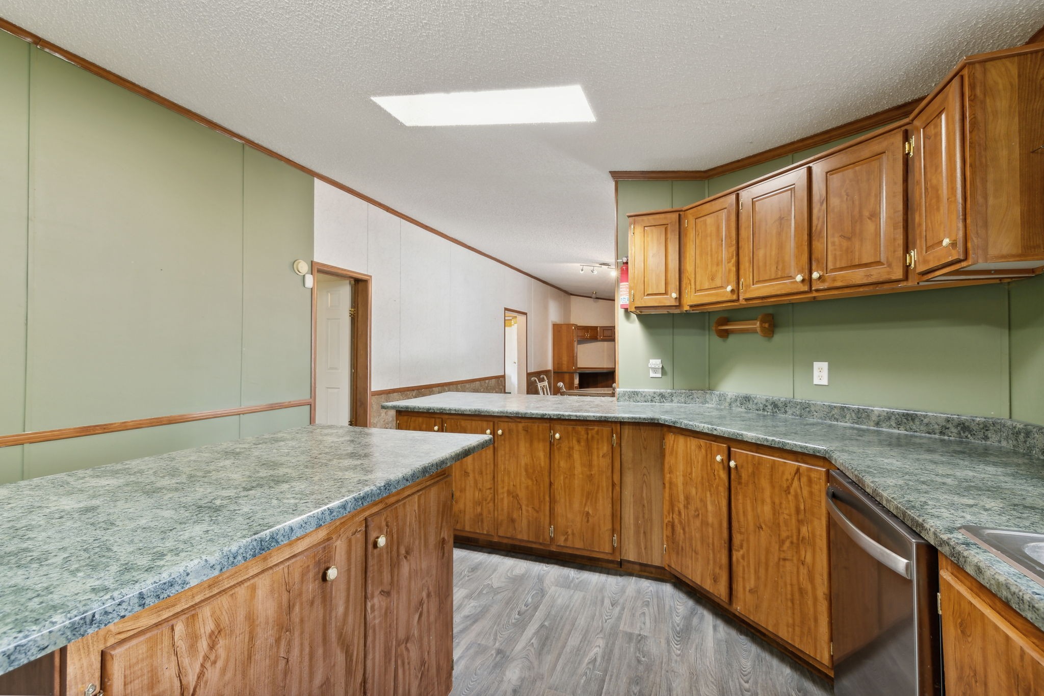 3270 Rocky Valley Road Lebanon, TN 37090 - Photo 17 of 55 a kitchen with stainless steel appliances granite countertop a sink a stove cabinets and entryway