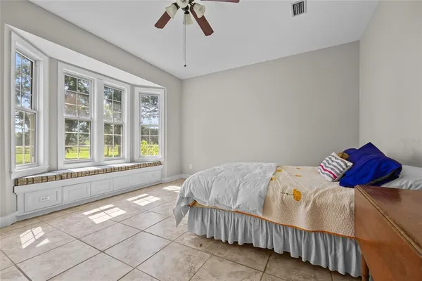 a bedroom with a bed and window