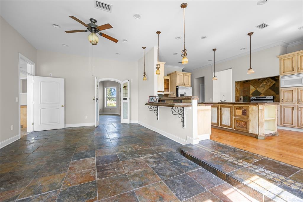 10852 89th Road Live Oak, FL 32060 - Photo 2 of 40 a view of a kitchen with kitchen appliances and a ceiling fan