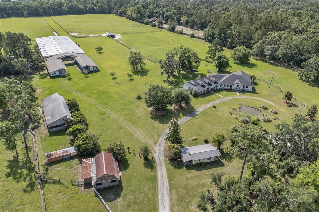 10852 89th Road Live Oak, FL 32060 - Photo 24 of 40 an aerial view of a house with pool yard and outdoor seating