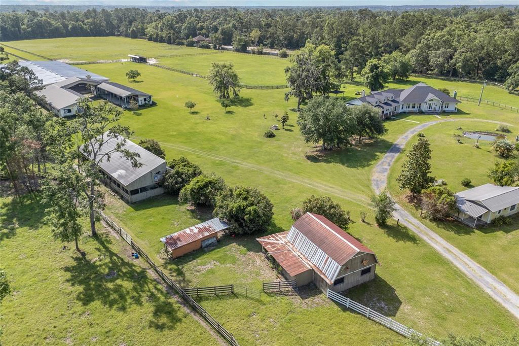 10852 89th Road Live Oak, FL 32060 - Photo 28 of 40 an aerial view of a house with a swimming pool