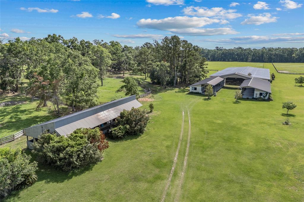 10852 89th Road Live Oak, FL 32060 - Photo 29 of 40 a view of a garden with lawn chairs