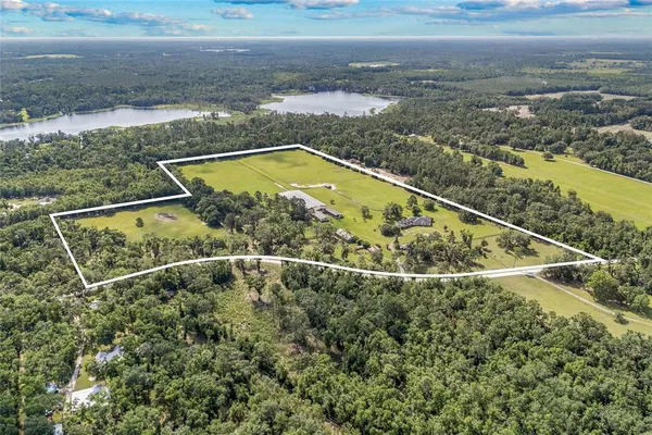 a view of a balcony with a yard