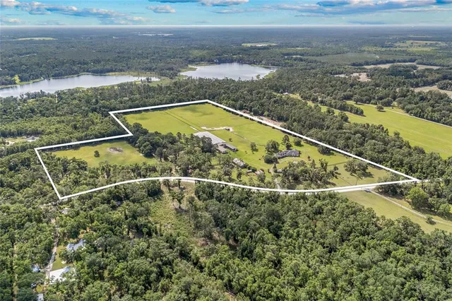 a view of a balcony with a yard