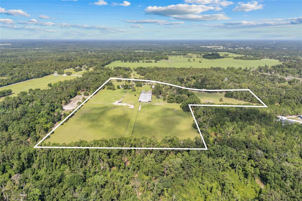10852 89th Road Live Oak, FL 32060 - Photo 37 of 40 an aerial view of residential houses with outdoor space