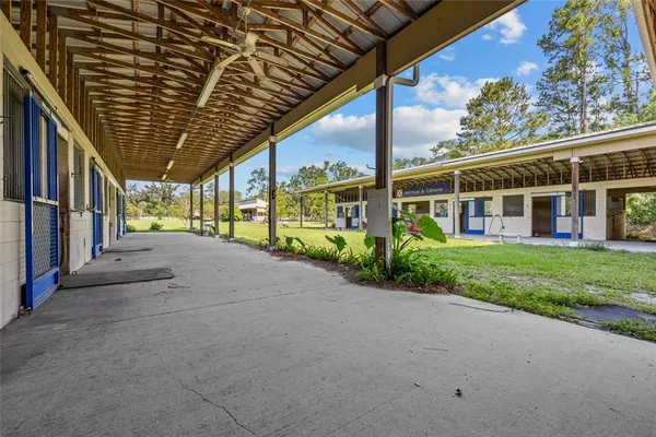 an aerial view of a house with swimming pool