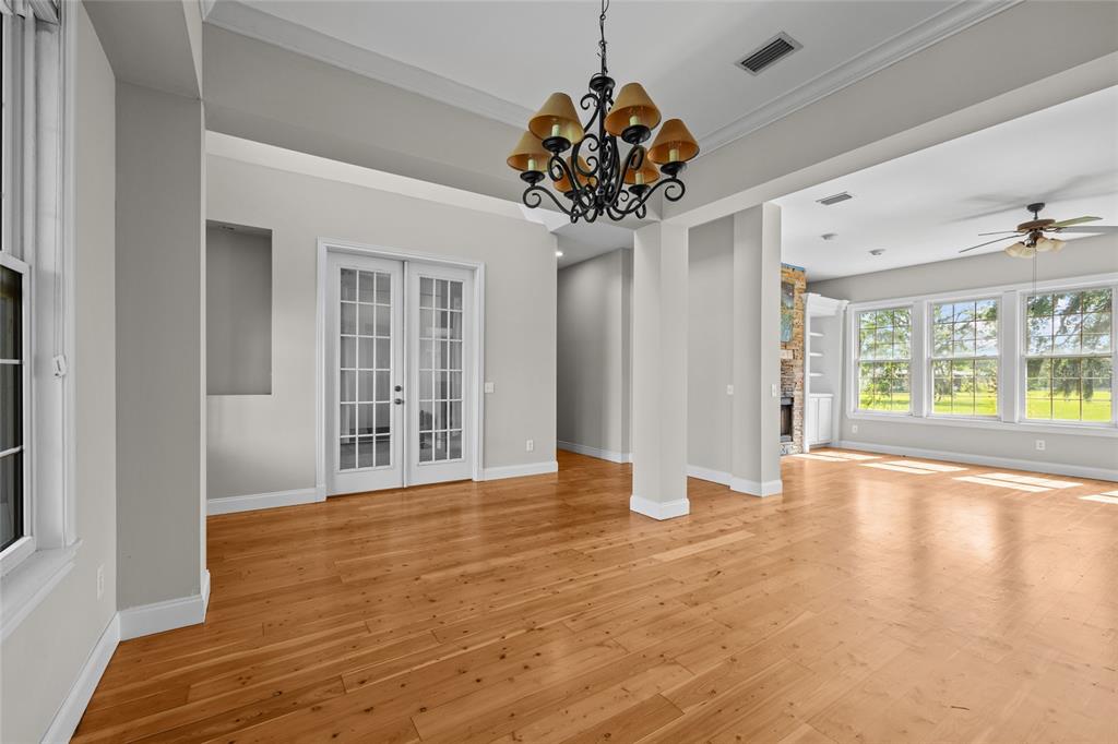 10852 89th Road Live Oak, FL 32060 - Photo 4 of 40 a view of an empty room with a chandelier