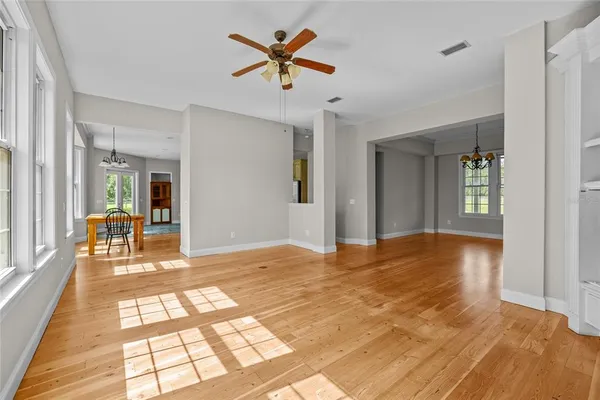 a view of livingroom with hardwood floor and a ceiling fan