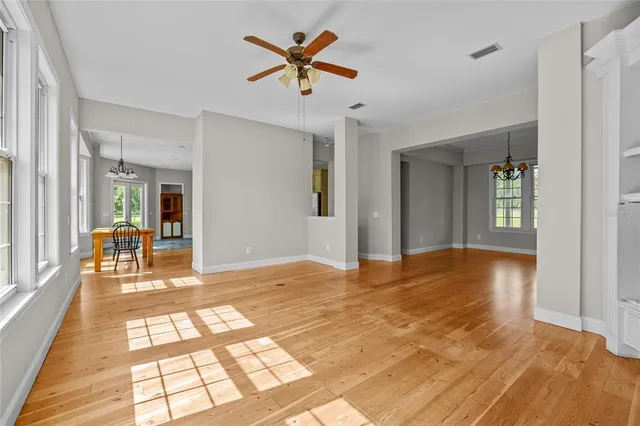 a view of livingroom with hardwood floor and a ceiling fan