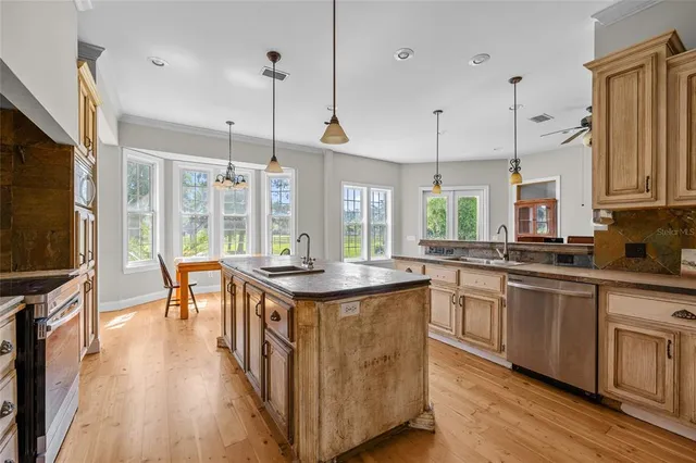 a kitchen with counter and wooden floor