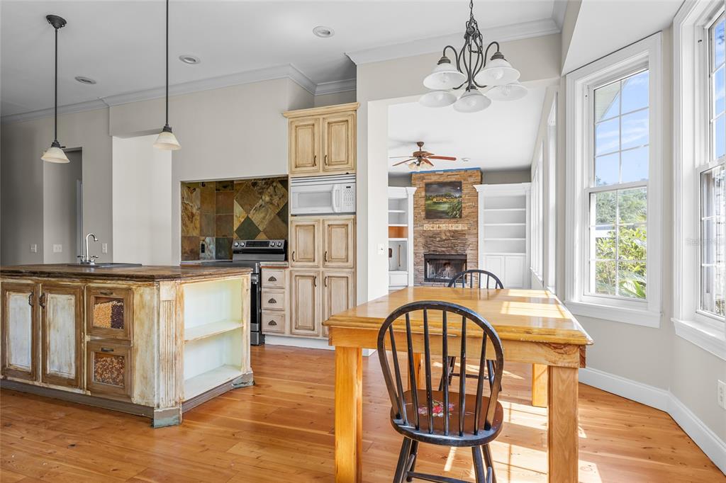 10852 89th Road Live Oak, FL 32060 - Photo 8 of 40 a view of a kitchen with furniture window and wooden floor