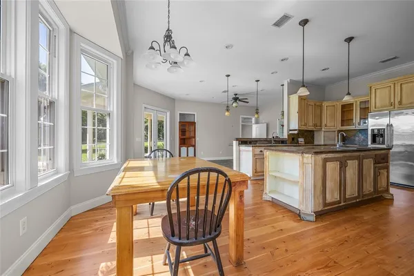 a very nice looking dining room with a large window